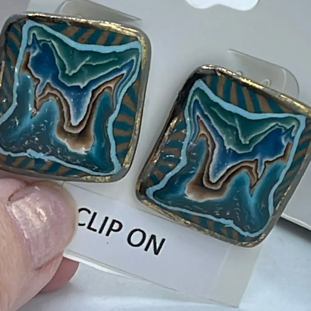 Vintage metal enamel clip style earrings.